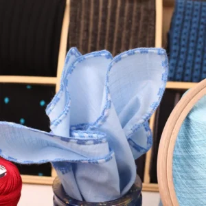 Wedding accessory gift idea – linen blue pocket square with rolled edges.