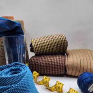 Three pairs of men's merino wool over the calf socks, yellow purple houndstooth, brown houndstooth and beige ribbed, EU 42-43.5